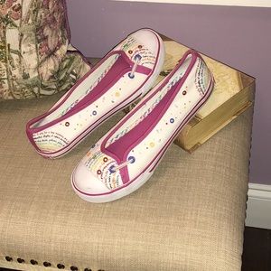 Pair of slip on canvas shoes.